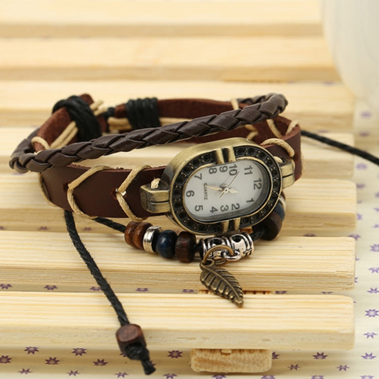 W01350 Orologio vintage con cinturino a foglia in pelle intrecciata