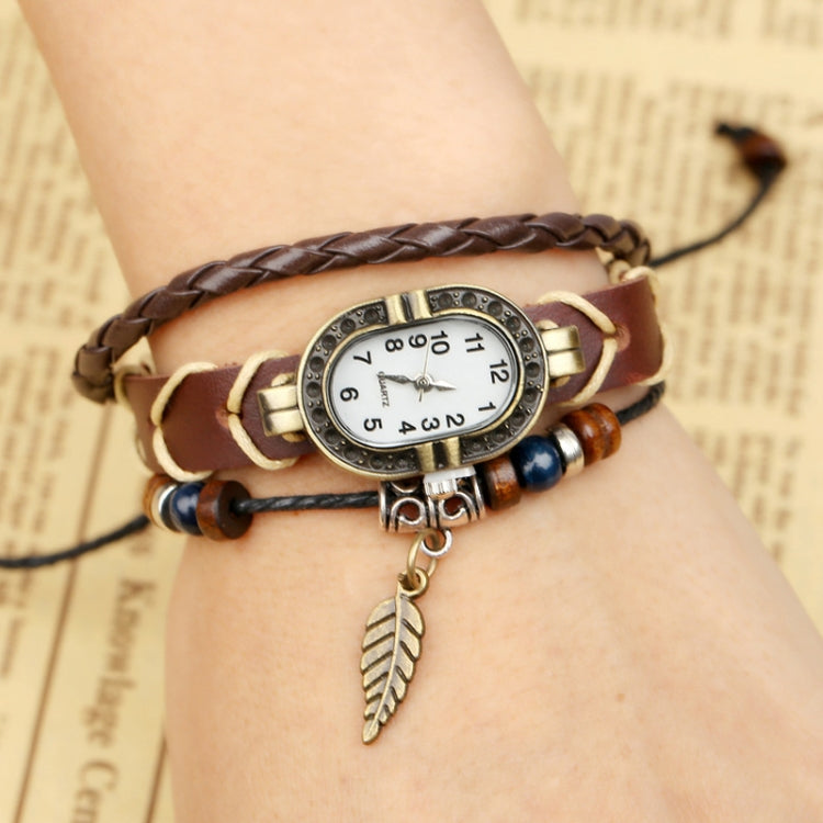 W01350 Orologio vintage con cinturino a foglia in pelle intrecciata