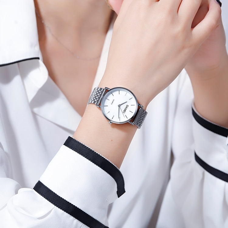 Skmei 1567 Leggero e sottile per il tempo libero Semplice orologio al quarzo da donna con cinturino in acciaio impermeabile da 30 m con quadrante a conchiglia